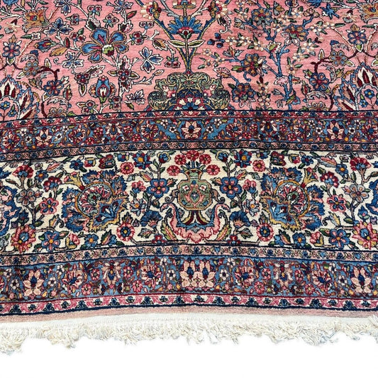 Early 20th Century Kerman Lavar Persian Rug, Hand-Knotted in Iran. Rose Field w/ Ivory Border Accented in Blue and Green. Fine Wool Pile on Cotton Foundation. Classic Overscale Room Size. Measures 11.06Lx19.01W. Circa 1920s.
