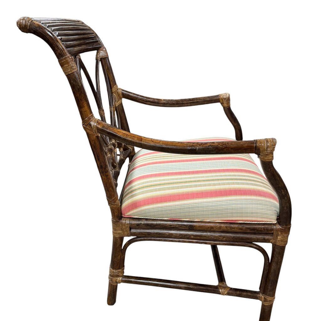Classic British Colonial–Style Rattan Armchair With Graceful Fan Back And Hand-Wrapped Joints. Finished In A Rich, Warm Stain With A Freshly Upholstered Striped Cushion In Soft Coastal Tones.