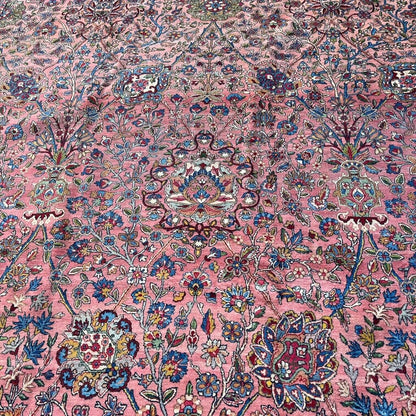 Early 20th Century Kerman Lavar Persian Rug, Hand-Knotted in Iran. Rose Field w/ Ivory Border Accented in Blue and Green. Fine Wool Pile on Cotton Foundation. Classic Overscale Room Size. Measures 11.06Lx19.01W. Circa 1920s.