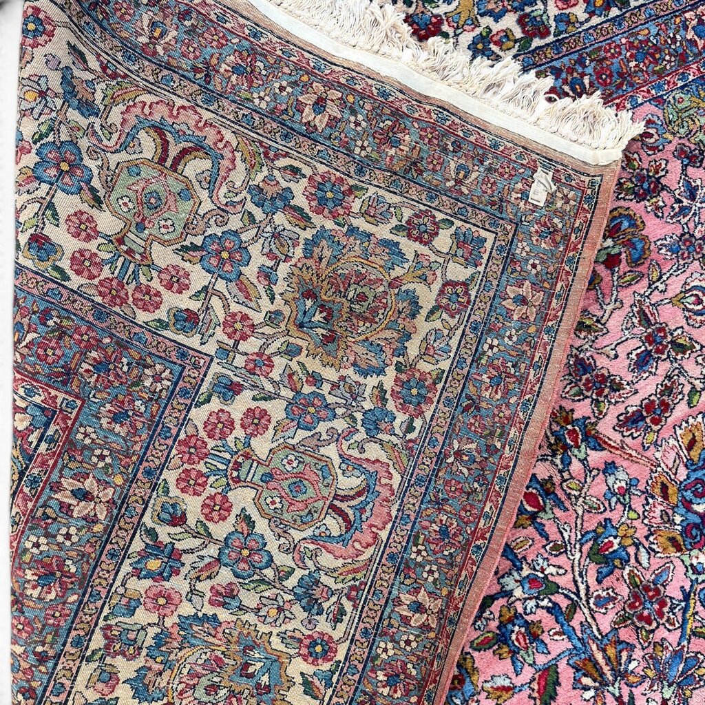 Early 20th Century Kerman Lavar Persian Rug, Hand-Knotted in Iran. Rose Field w/ Ivory Border Accented in Blue and Green. Fine Wool Pile on Cotton Foundation. Classic Overscale Room Size. Measures 11.06Lx19.01W. Circa 1920s.
