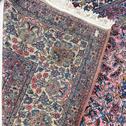 Early 20th Century Kerman Lavar Persian Rug, Hand-Knotted in Iran. Rose Field w/ Ivory Border Accented in Blue and Green. Fine Wool Pile on Cotton Foundation. Classic Overscale Room Size. Measures 11.06Lx19.01W. Circa 1920s.